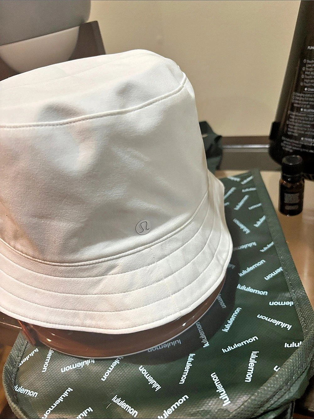 lululemon Both Ways Bucket Hat in White/Tan and bag
